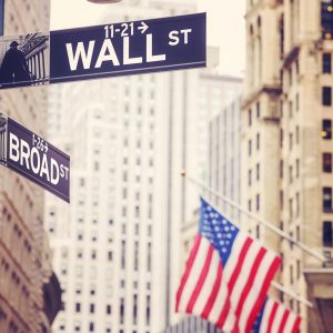 Wall Street and Broad Street signs.